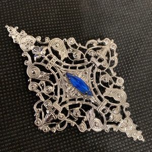 Vintage 80’s silver metal with blue stone brooch